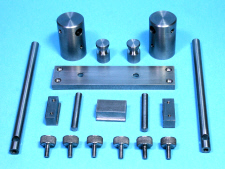 Filing Machine, hold down components.